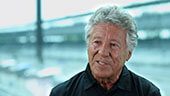 Still image of Mario Andretti interview.